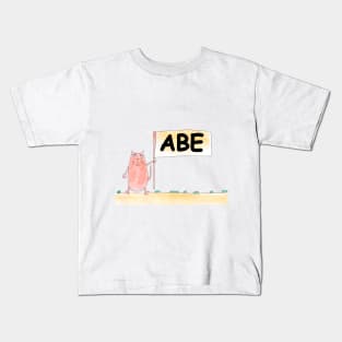 АВЕ name. Personalized gift for birthday your friend. Cat character holding a banner Kids T-Shirt